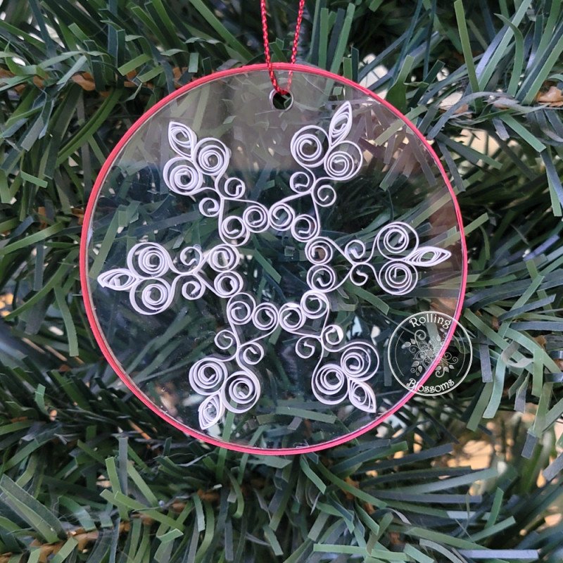 Quilled snowflake Christmas tree ornament on a three inch clear acrylic disk by Rolling Blossoms Quilled snowflake Christmas tree ornament on a three inch clear acrylic disk by Rolling Blossoms