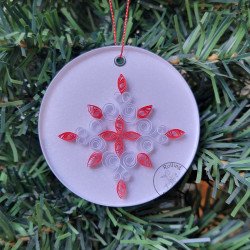 Quilled red and white star Christmas tree ornament on a three inch clear acrylic disk by Rolling Blossoms
