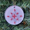 Quilled red and white star Christmas tree ornament on a three inch clear acrylic disk by Rolling Blossoms