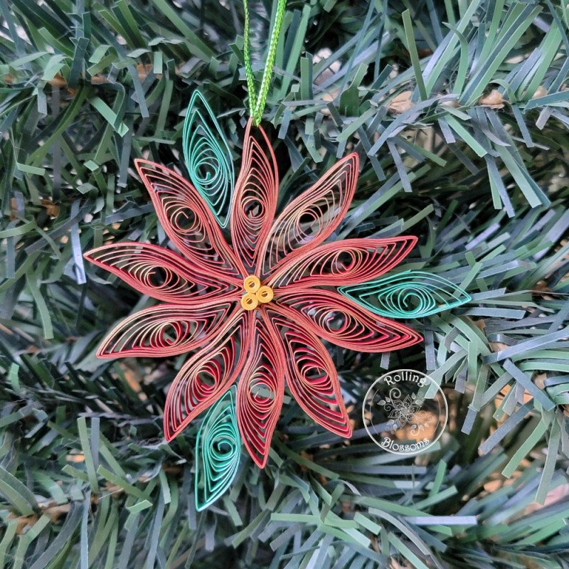 Quilled poinsettia ornament with a metallic gold edge by rolling blossoms Quilled poinsettia ornament with a metallic gold edge by rolling blossoms