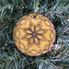 Quilled black and gold Christmas tree ornament on a three inch clear acrylic disk by rolling blossoms