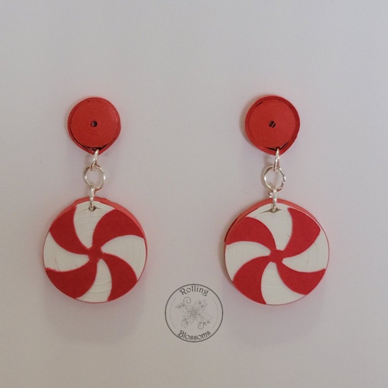 Quilled red peppermint stud earrings with red post by rolling blossoms. Quilled red peppermint stud earrings with red post by rolling blossoms.