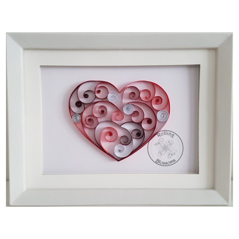 Quilled red heart filled with red and silver swirls by rolling blossoms Quilled red heart filled with red and silver swirls by rolling blossoms