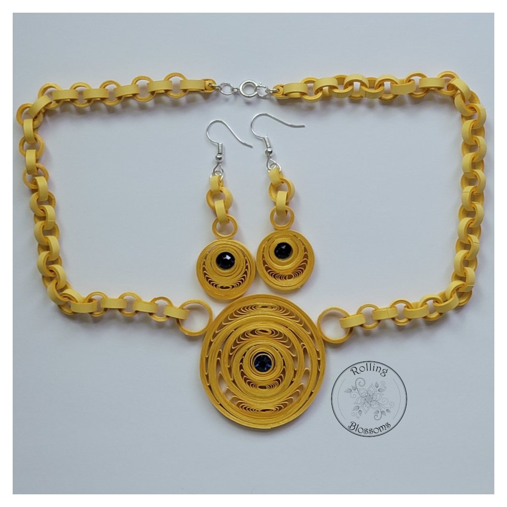 quilled gold jewelry set with blue gems