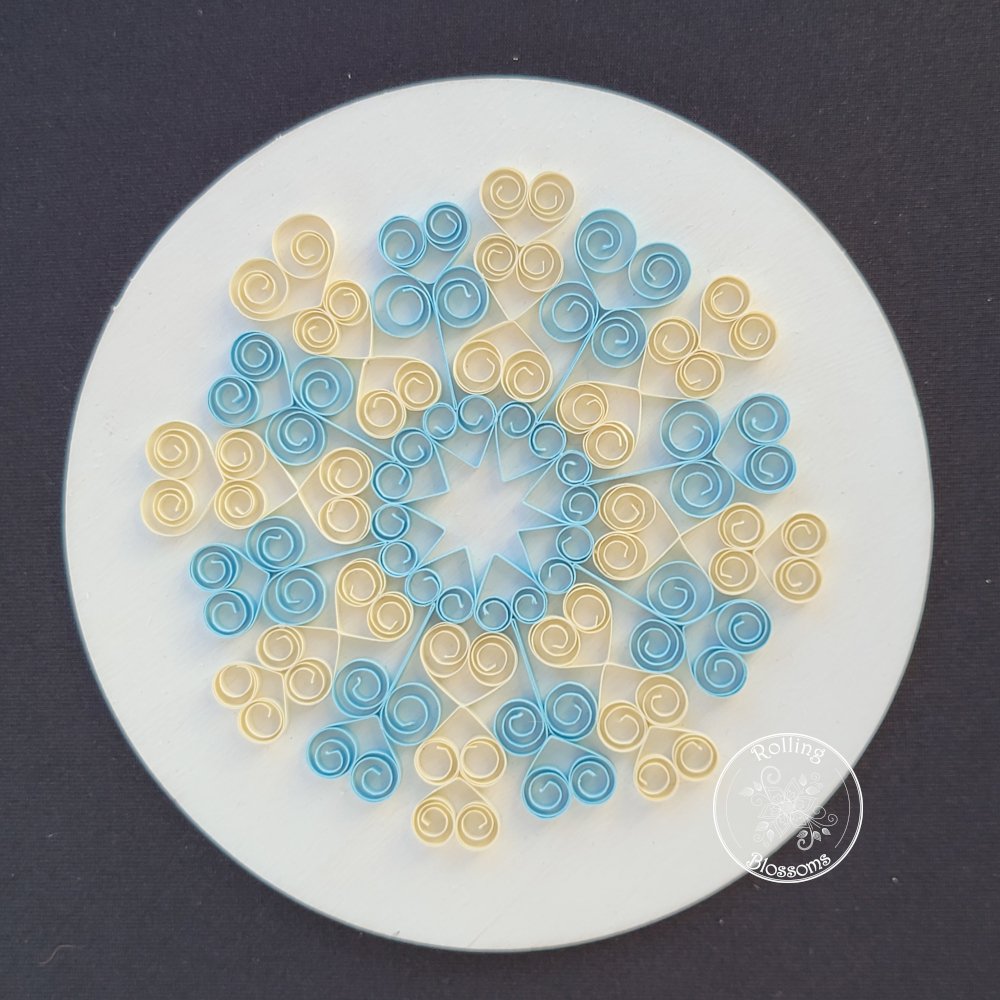 quilled blue and cream snowflake mandala plaque by rolling blossoms